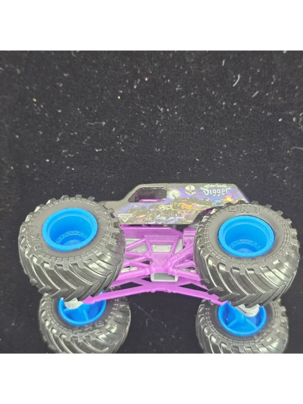 Grave Digger Monster Truck Toy Purple & Black 2024 Copyright Skeleton Design 4-W
